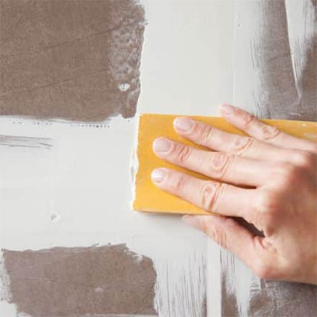 sand the smoothing plaster