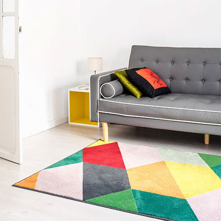 Brighten up the room by treating bare floors to a lightly-colored carpet