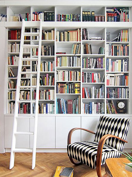 reading nook or library with kitchen cupboards