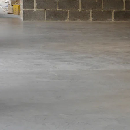 screed floor after application of concrete overlay