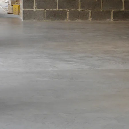 screed floor after application of concrete overlay