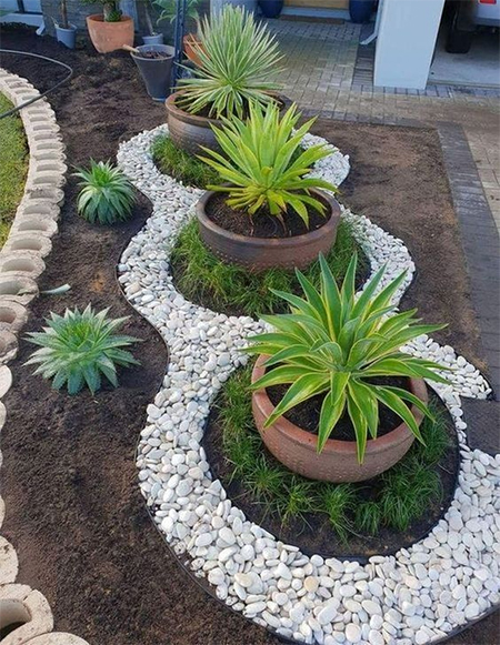 decorate flower beds with pebbles or stones