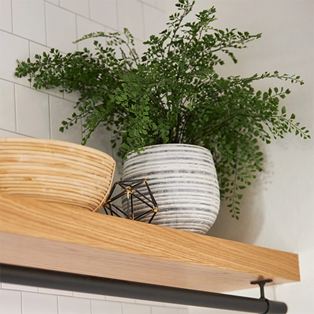 floating shelves with hanging rail underneath