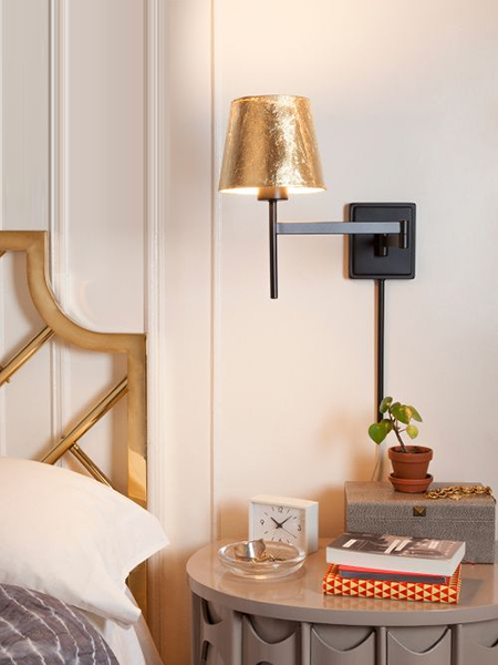 gold leaf on wall mounted sconce light