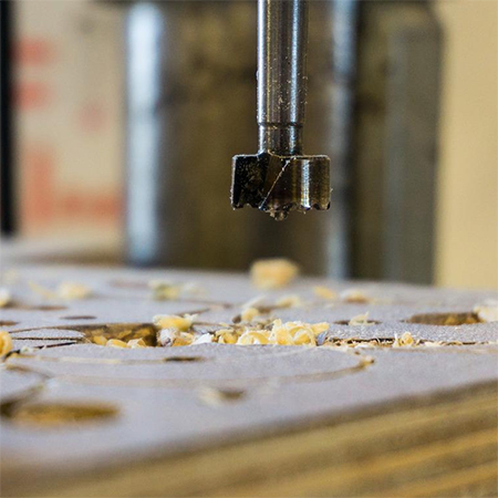 blow away excess sawdust to reduce wear on cutting blades