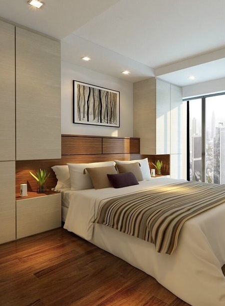 built-in cupboards for clothing around top of bed