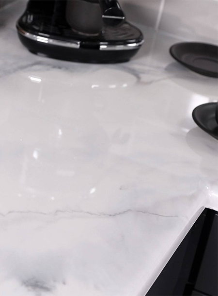 The veins in marble run diagonally with blurred or softened edges