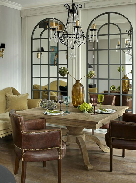 use mirrors to brighten a room and visually enlarge the space