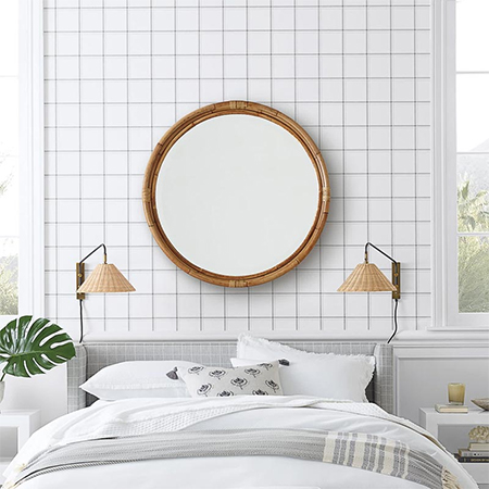 mount mirror behind the bed