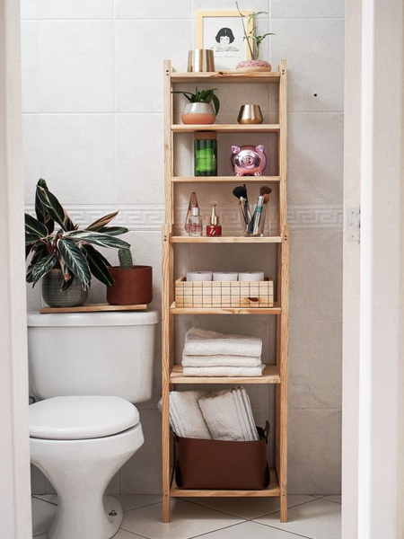 wooden storage next to toilet