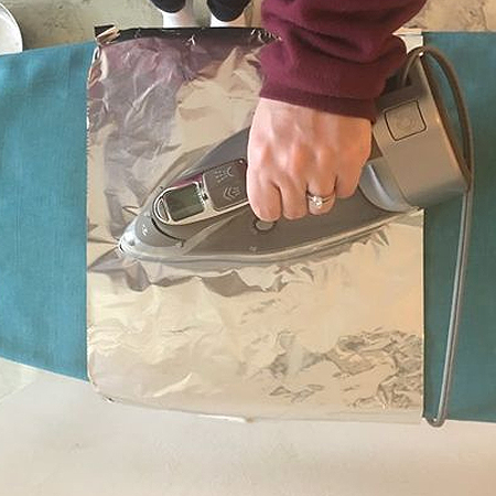 use tin foil when ironing