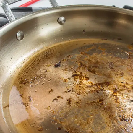 clean pots and pans with vinegar and salt