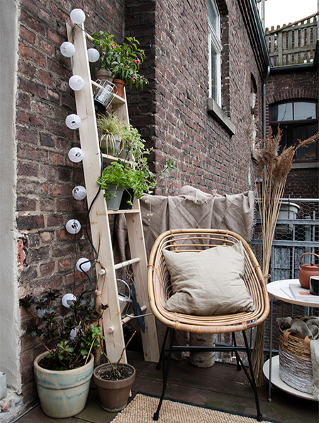 A DIY Ladder that offers a Place for Plants and Ambient Lighting