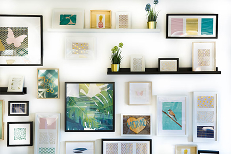 Gallery wall with different pictures and open shelves