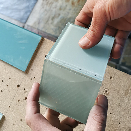 cut curved tiles to fit around sink or toilet