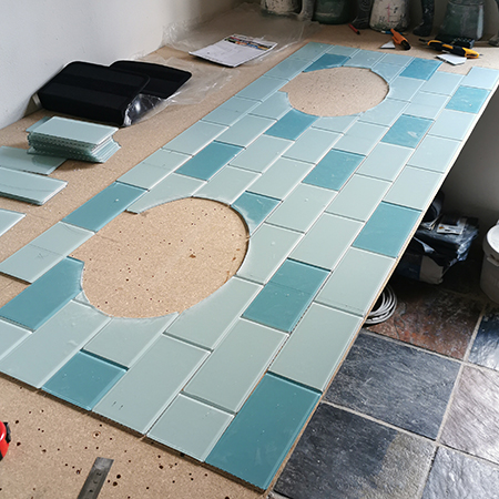 cut curved tiles to fit around sink or toilet
