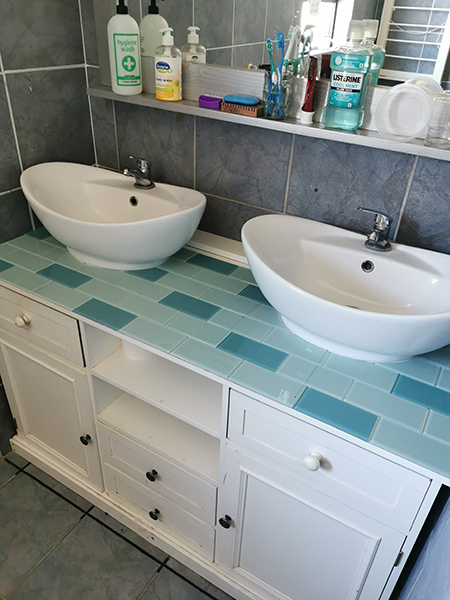 cut curved tiles to fit around sink or toilet