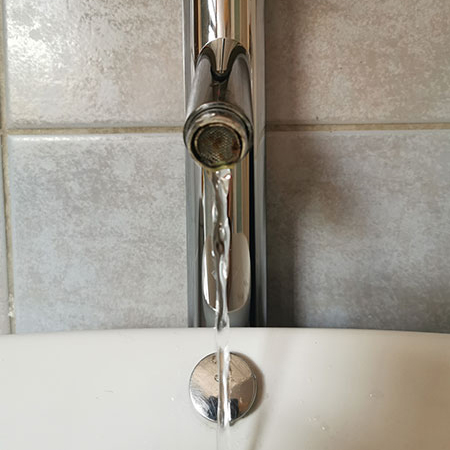 why does the water run slowly from taps
