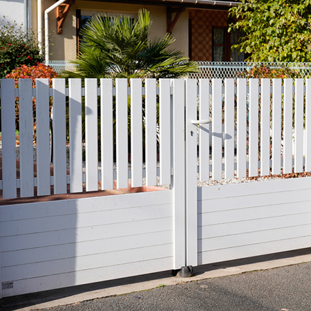 fence painted to complement a particular garden design