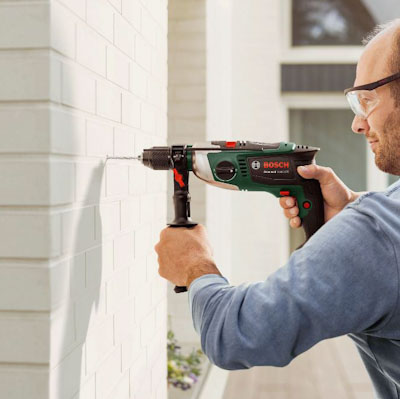 how to drill into walls