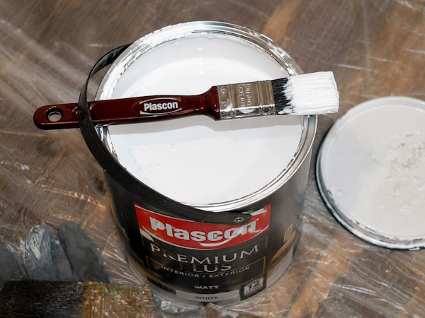 Apply the primer in long, even strokes and allow it to dry fully before painting