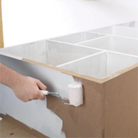 Use a wood primer and a foam roller 