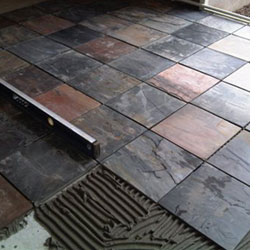 Lay a slate tile floor or wall 